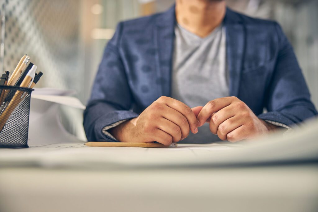 close up of man sitting at desk