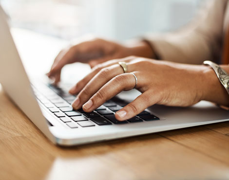 Woman typing on keyboard